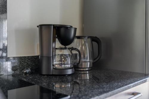 a coffee maker sitting on a kitchen counter at De Hoog Velden 14 in Pelt