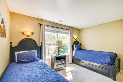 a bedroom with two beds and a window at Cozy Resort-Style Escape on Taylorsville Lake! in Taylorsville
