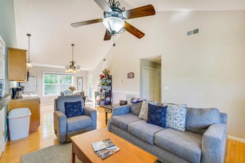 a living room with two couches and a ceiling fan at Taylorsville Lake Cottage Rental with Hot Tub! in Taylorsville