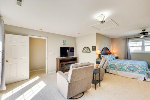 a bedroom with a bed and a couch and a tv at Taylorsville Lake Cottage Rental with Hot Tub! in Taylorsville