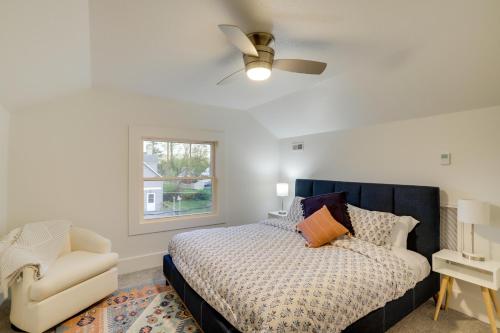 a bedroom with a bed and a chair and a window at Indiana Vacation Rental - Walk to Syracuse Lake! in Syracuse