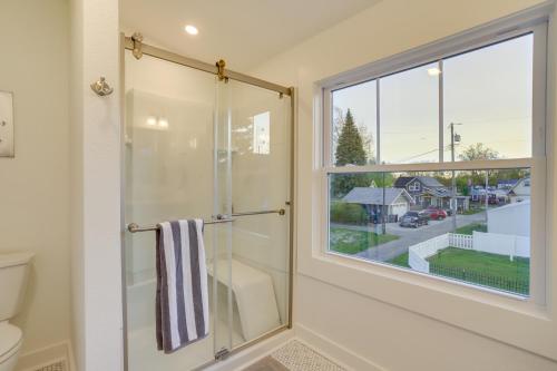 a bathroom with a shower and a window at Indiana Vacation Rental - Walk to Syracuse Lake! in Syracuse