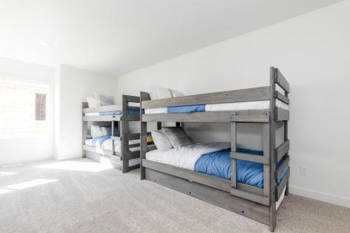a bedroom with two bunk beds in a room at Brand New Garden City 3BR 2BA BOAT PARKING in Garden City