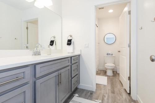 a bathroom with a sink and a toilet at Bear Lake Fun Close to lake Electric Scooters in Garden City