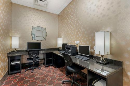 an office with two desks with computers and chairs at Best Western Plus The Charles Hotel in St. Charles