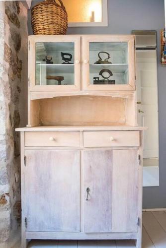 a white hutch with a basket on top of it at Maro Skyline in Dubrovnik