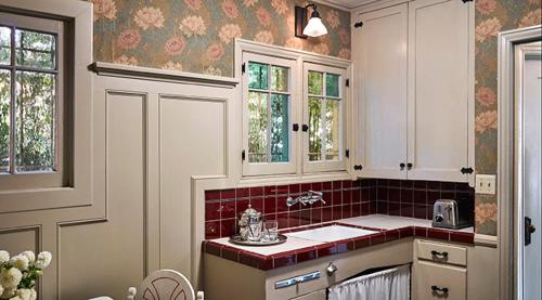a kitchen with a sink and red tile at Chateau Marmont in Los Angeles