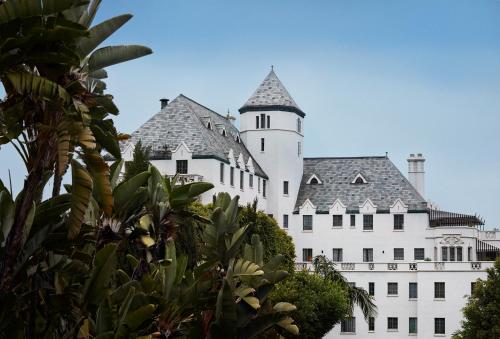 a large white building with a tower on top at Chateau Marmont in Los Angeles