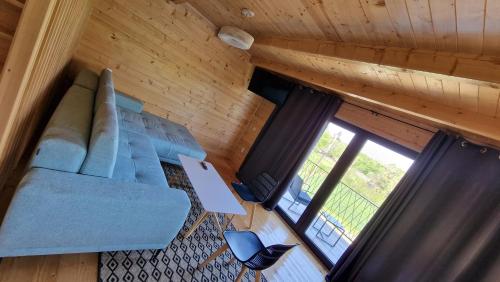 an overhead view of a living room in a log cabin at NEO resort jezero Bruje in Erdevik