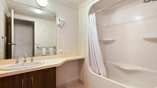 a bathroom with a sink and a shower at Alpine Heights 04 in Mount Hotham