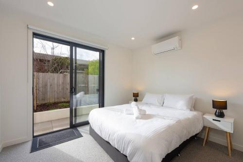 Ένα ή περισσότερα κρεβάτια σε δωμάτιο στο Modern 3BR Getaway next to Chadstone