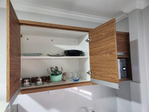 Kuchyň nebo kuchyňský kout v ubytování Araras Apart Service Caldas Novas