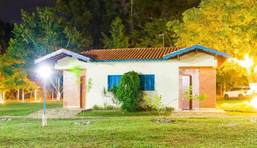 a small house with a light in front of it at Stallage Hotel in São Pedro