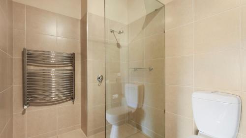 a bathroom with a toilet and a shower at Chalet Hotham 13 in Mount Hotham