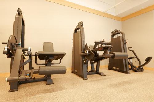 a gym with cardio equipment in a room at Residence Hotel K Okpo in Geoje 