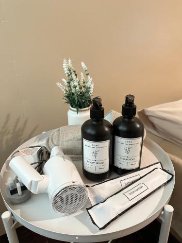 two bottles of hair products on a table at Zara Lodge in Bario
