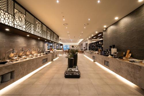 a restaurant with a long aisle with a counter at Sono Belle Cheongsong in Cheongsong