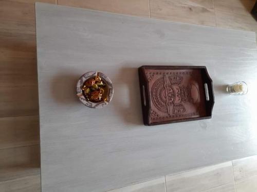 a chocolate bar and a bowl on a counter at Depto Rawson Home in Rawson