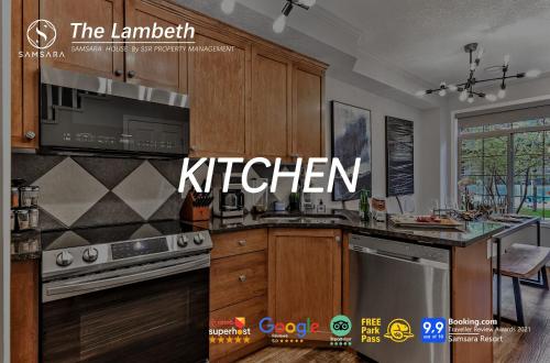 a kitchen with wooden cabinets and a kitchen sign at The Lambeth by Samsara Resort Private Entry Panorama Top View 2BR and 2BTH in Canmore
