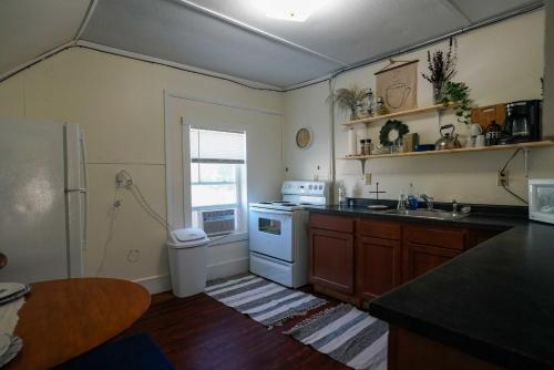 a kitchen with a sink and a stove at 2 Bedroom Apartment near NDSU and Downtown Fargo in Fargo