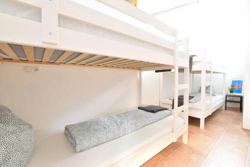 a bedroom with two bunk beds in a room at Huge Apartment in Awesome Location with parking in Innsbruck