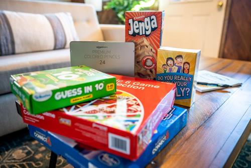 a pile of pizza boxes sitting on a table at Great Views! A-Frame w Hot Tub, Grill & Fire Pit in Morton Grove