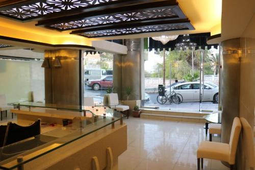 a lobby with a car parked in a parking lot at فندق كلاسيك in Aqaba