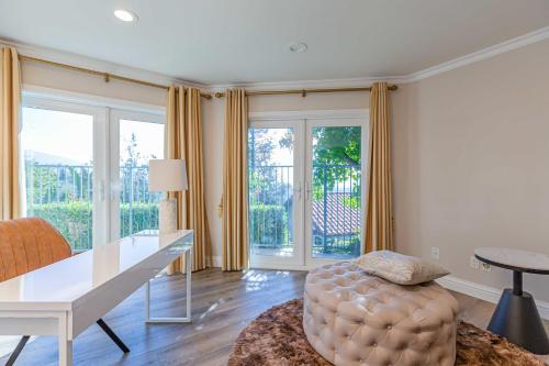 a living room with a white table and a couch at Single Level House with view and pool in Glendora