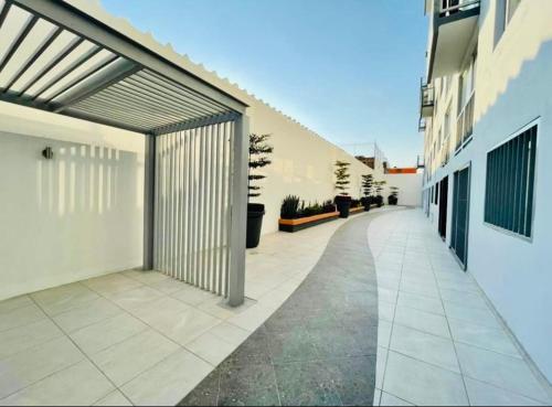 an empty hallway of a building with a garage at Depa M&M in Guadalajara