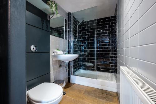 a bathroom with a toilet and a sink and a shower at Host & Stay - Preston's Rooftop Apt in Liverpool
