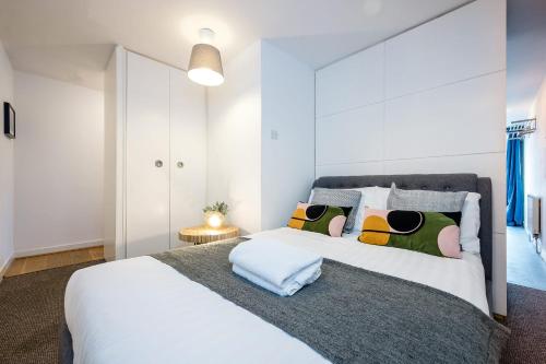 a bedroom with a large white bed with pillows at Host & Stay - Preston's Rooftop Apt in Liverpool