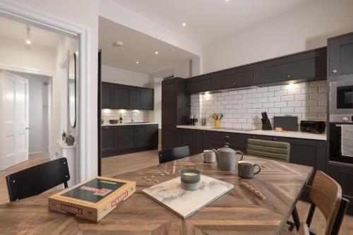 a kitchen and dining room with a table with a box on it at Spacious Apartment in Coniston, by LetMeStay in Coniston