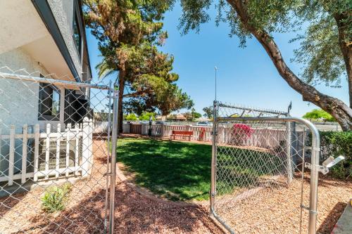 a chain link fence in front of a yard with a swing at Phoenix Studio King Deluxe in Phoenix