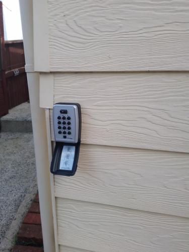 a remote control on the side of a house at Lioness Estate - Dunedin in Dunedin
