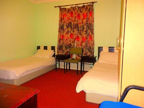 מיטה או מיטות בחדר ב-City View Hotel