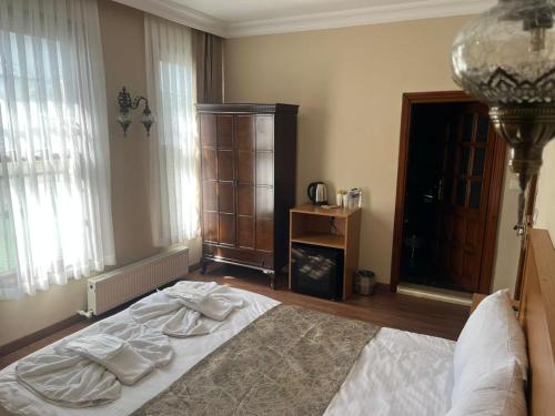 Postel nebo postele na pokoji v ubytování Ottoman Elegance Hotel
