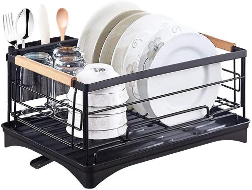 a black shelf with dishes and utensils on it at Casa South in Stockholm