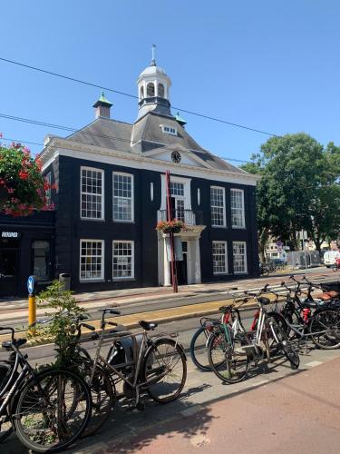 a group of bikes parked in front of a building at Bob W Oosterpark in Amsterdam