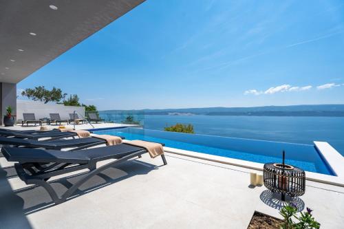Villa Admira Maria with a heated pool and sea views