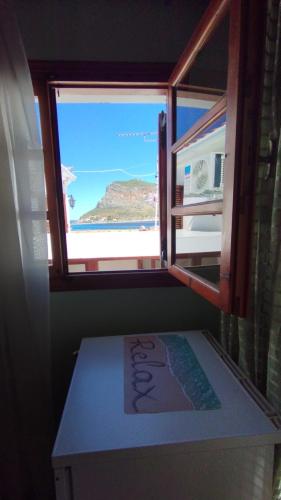 a window in a room with a view of the ocean at AGNANTIO in Monemvasia