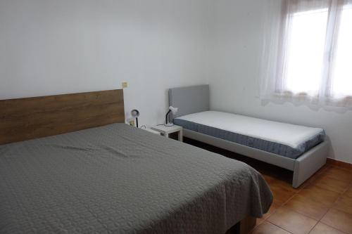 Кровать или кровати в номере Villa in Kalloni direkt am Meer, tolle Aussicht