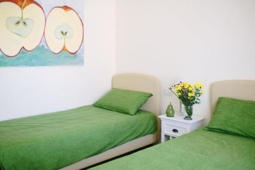 Katil atau katil-katil dalam bilik di Agriturismo Familiare I Giardini del Lago