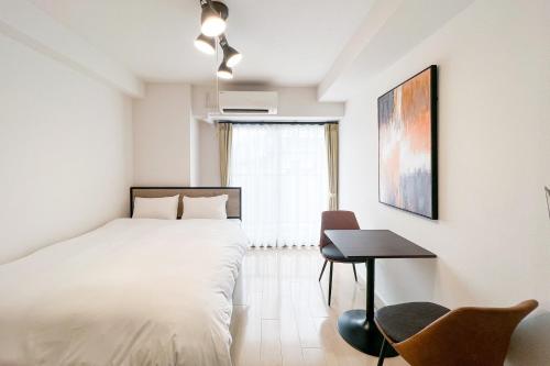 Llit o llits en una habitació de Locanda shin-Osaka