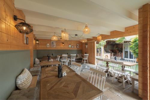 a dining room with a table and chairs at Florence Gardens Boutique Hotel and Restaurant in Portsmouth