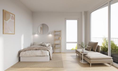 Habitación blanca con cama y sofá en Snowflake Suites VII, en Rovaniemi