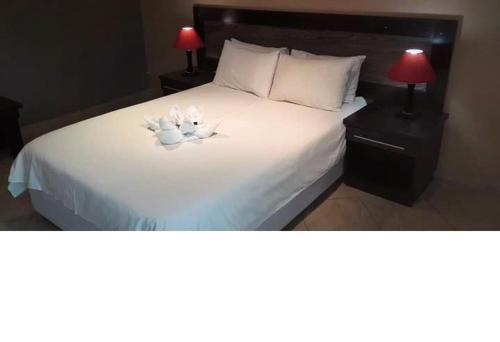 Katil atau katil-katil dalam bilik di Omashare Hotel