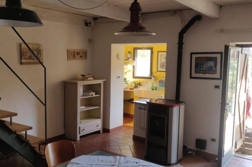 a kitchen with a counter and a sink in a room at Casa Camino in Rubiana