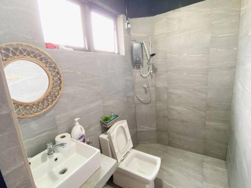 a bathroom with a white toilet and a sink at B03 Create SweetExperience In Larkin in Johor Bahru