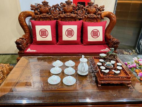a table with chocolates and desserts on a couch at Sky Hotel & Homestay Ha Giang in Ha Giang
