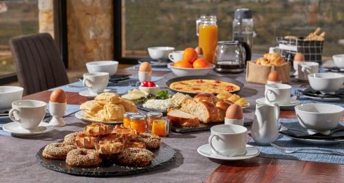 a table topped with plates of food on top at Alagni Cretan Resort in Alagni